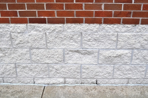 Figure 2: Control joints in this 4” CMU veneer were placed 24’-0” o.c. to accommodate the clay brick expansion above.  However, CMU control joints should have been placed no more than 12’-0” o.c., with horizontal joint reinforcement in the CMU spaced appropriately.  